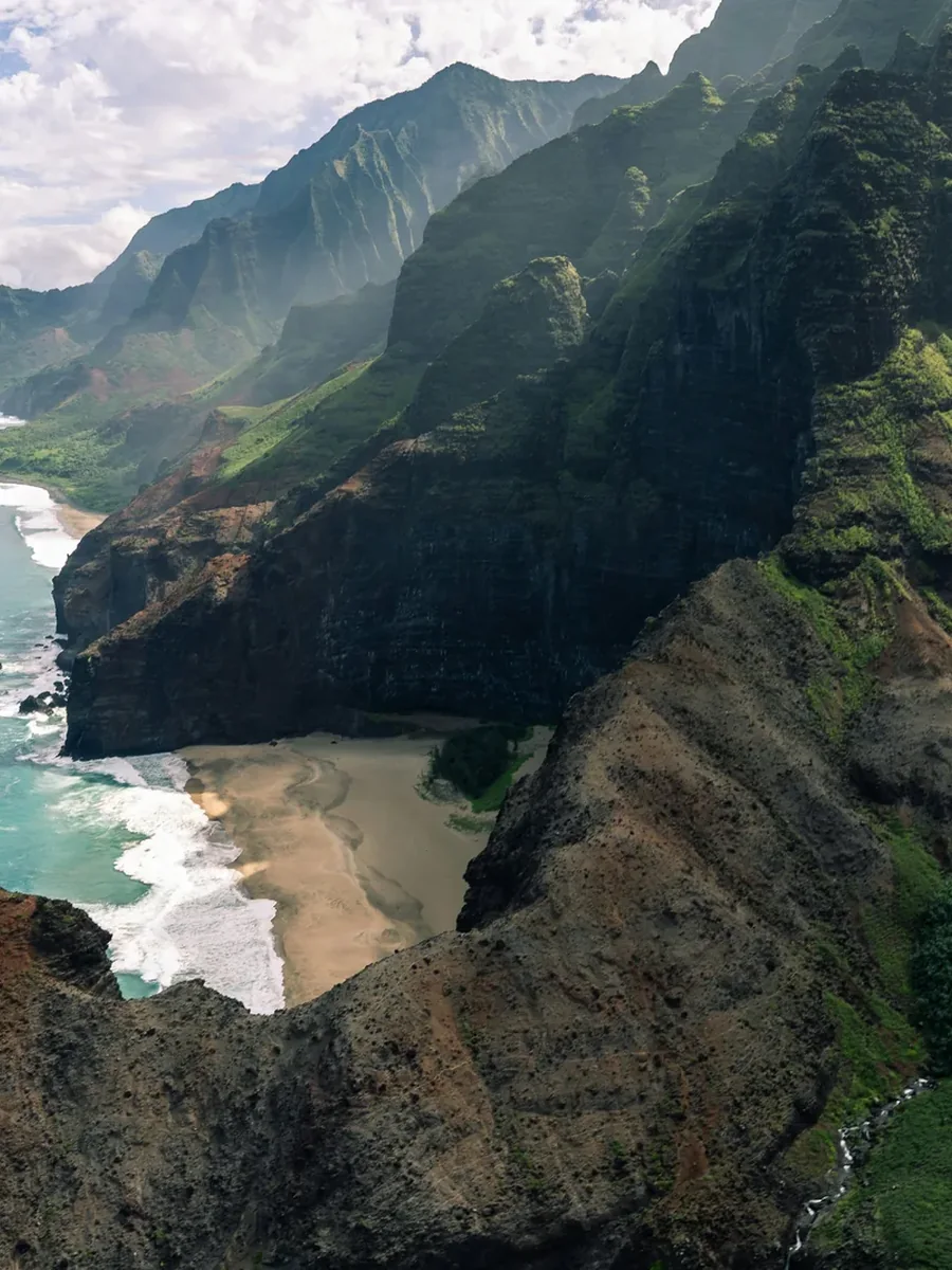 The green sea cliffs of the Na Pali Coast on Kauai above the Pacific