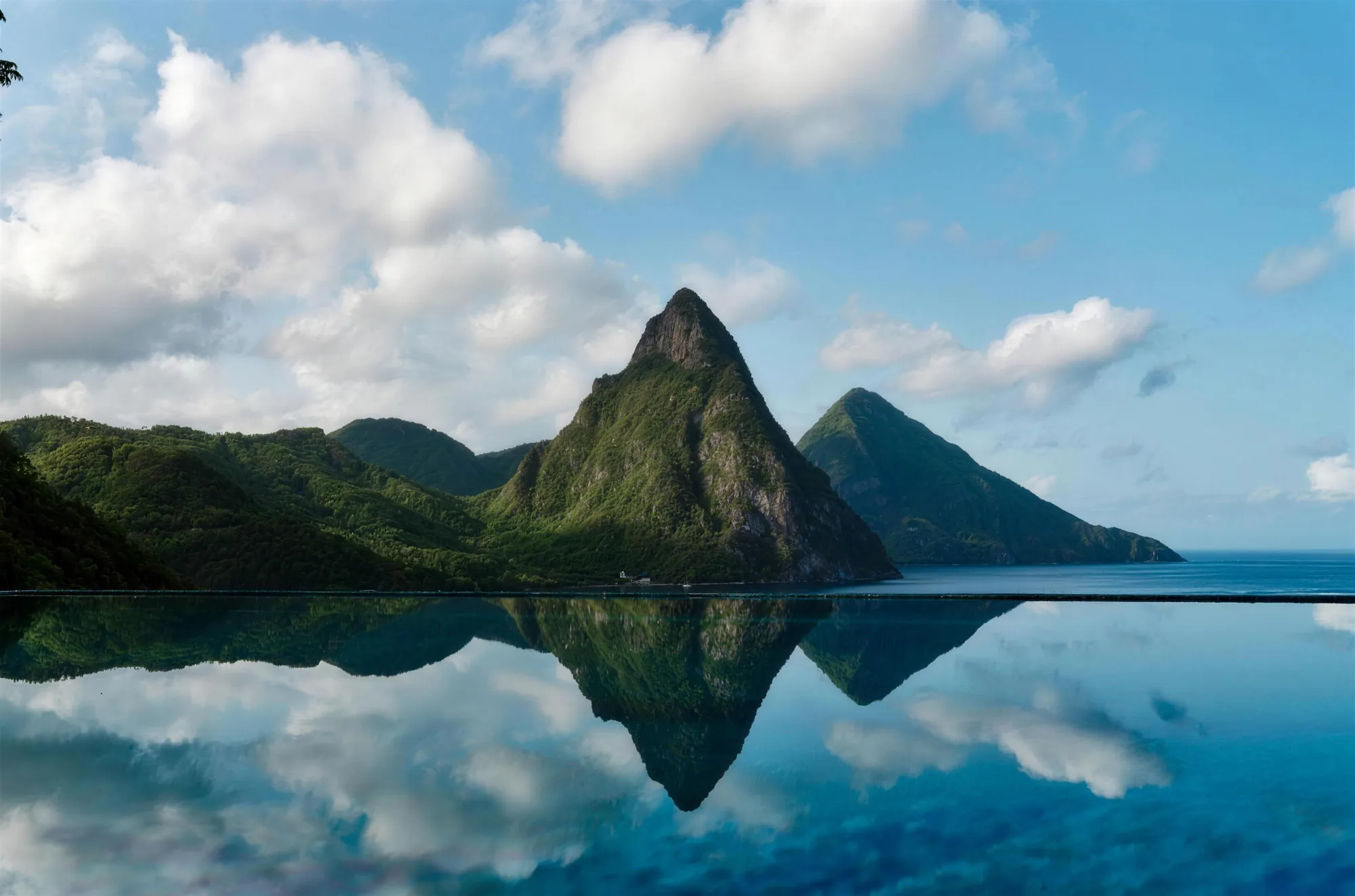 A still infinity pool reflecting the twin Pitons of Saint Lucia
