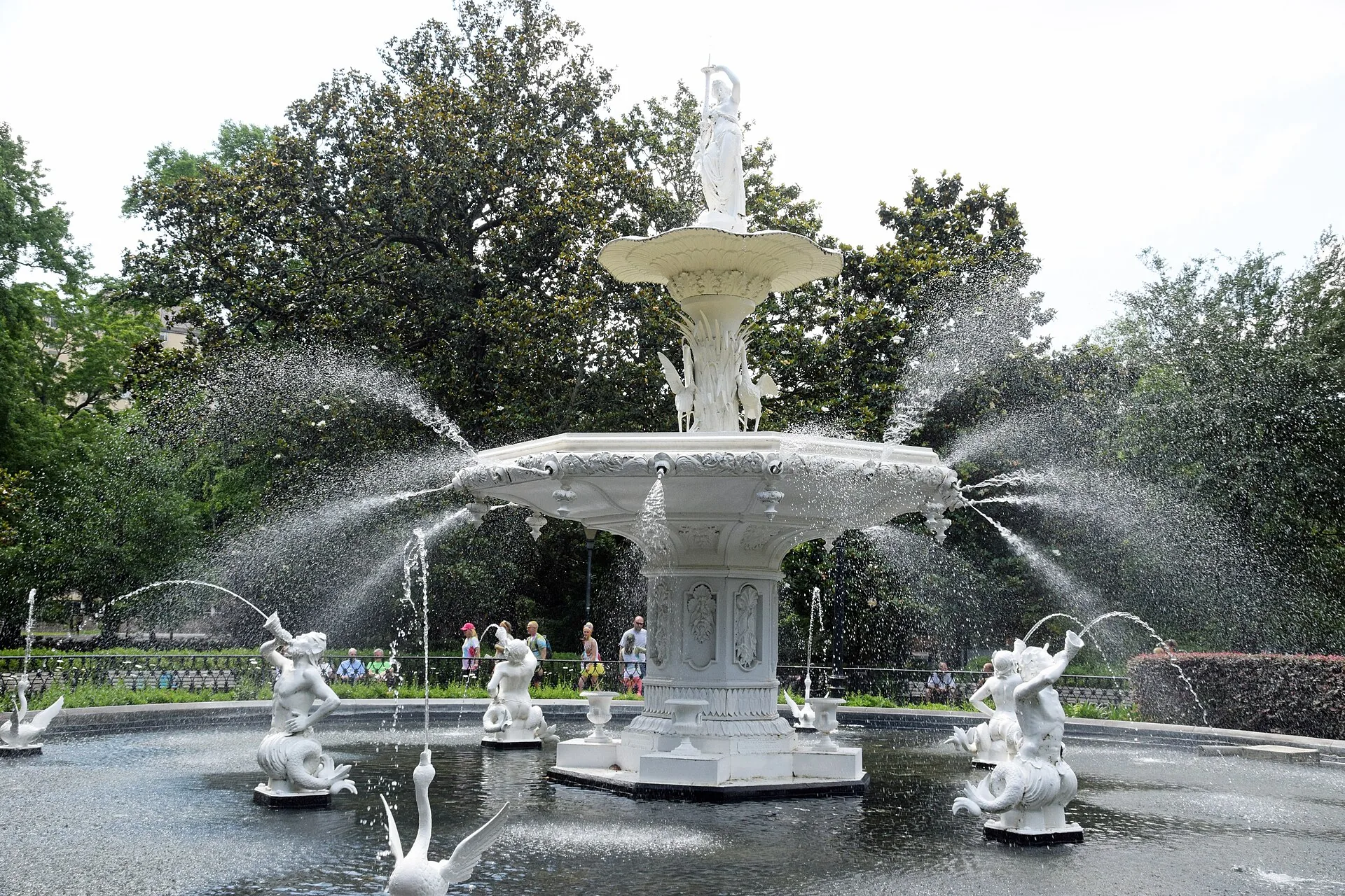 Live oak trees draped in Spanish moss around a fountain in Forsyth Park, Savannah, Georgia