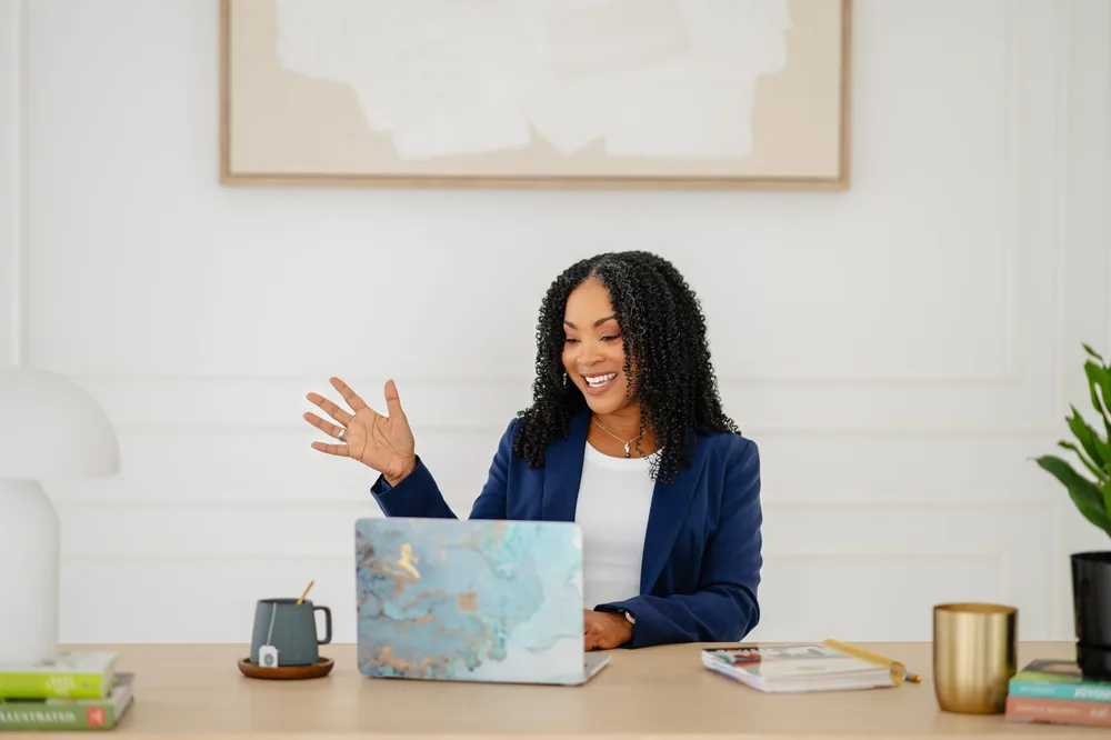Kay Jones smiling in a bright studio