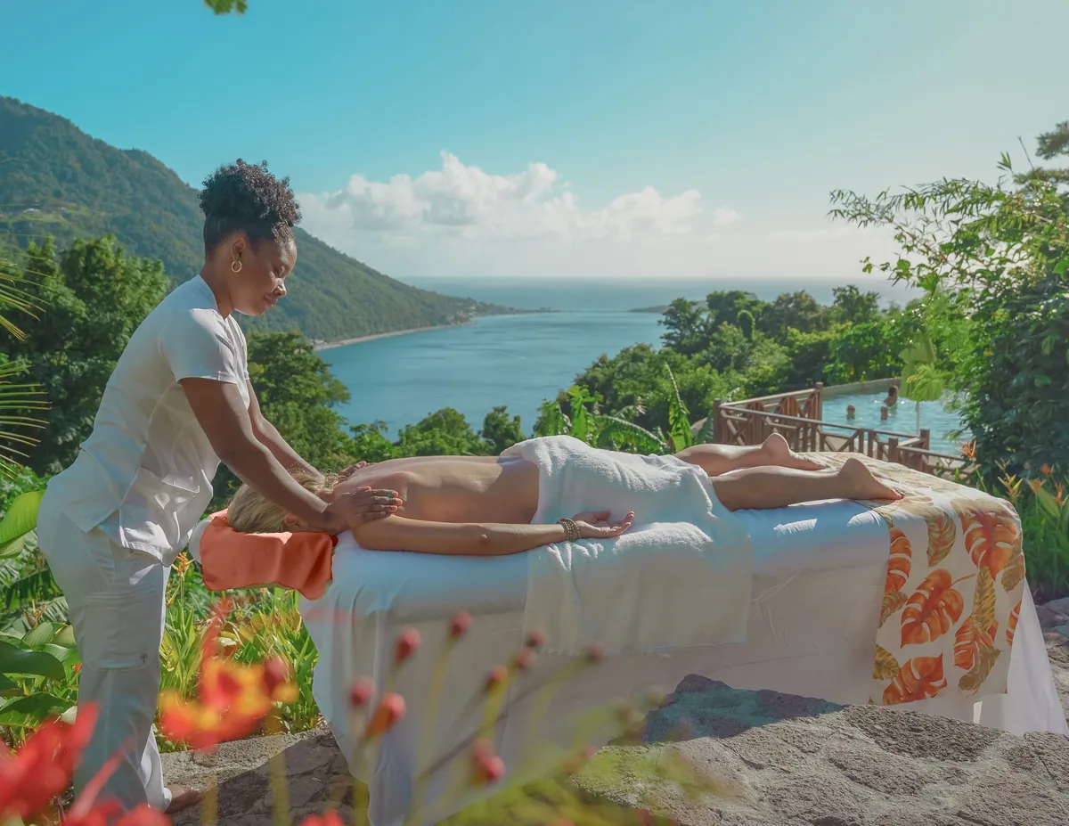 A massage in the open air above a hillside pool, the sea in the distance